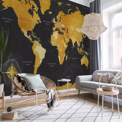 Wall Murals with a world map in gold color on a black background - 95022 G-ART