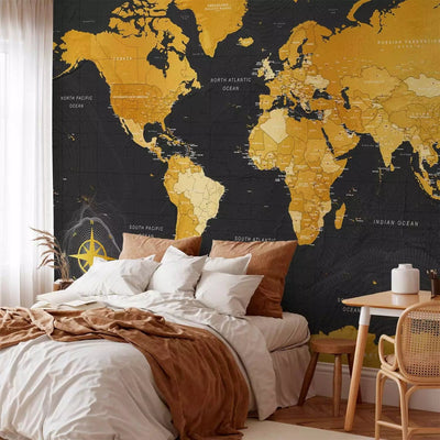 Wall Murals with a world map in gold color on a black background - 95022 G-ART